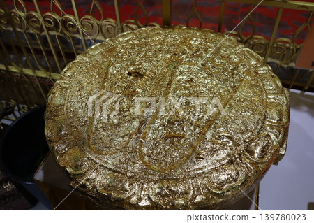 Golden Ornate Religious Artifact Close-up Golden Ornate Religious Artifact Close-up 139780023
