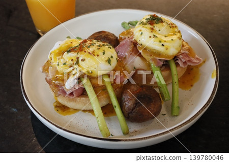 Eggs Benedict with Mushrooms and Asparagus on Plate Eggs Benedict with Mushrooms and Asparagus on Plate 139780046