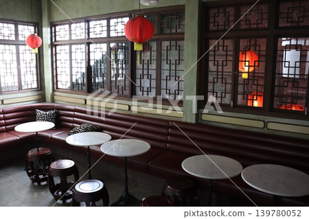 Traditional Chinese Restaurant Interior with Red Lanterns and Booths Traditional Chinese Restaurant Interior with Red Lanterns and Booths 139780052