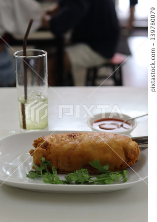 Fried Snack with Drink and Garnish on Plate Fried Snack with Drink and Garnish on Plate 139780079