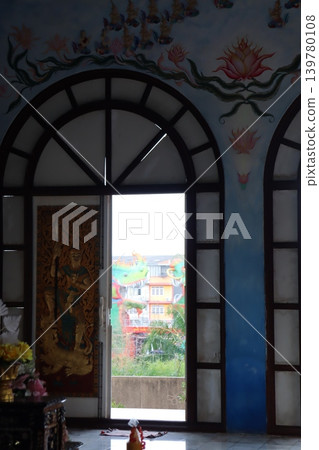 Temple Interior with Decorative Window and Outdoor View 139780108