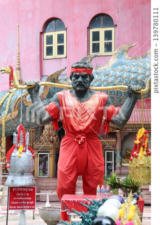 Thai Deity Statue with Bow and Red Attire Thai Deity Statue with Bow and Red Attire 139780111