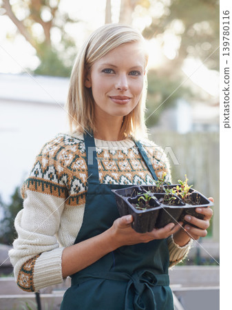 Gardening, seedling and portrait of woman with plants for landscaping, planting flowers and growth. Agriculture, nature and face of person outdoors for environment, ecology and nursery in garden 139780116
