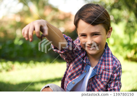 Boy, smile and portrait holding a worm in a garden for fun learning, development and growth. Curious, happy and young male person with a bug animal in nature for ecology education in environment Boy, smile and portrait holding a worm in a garden for fun learning, development and growth. Curious, happy and young male person with a bug animal in nature for ecology education in environment 139780150