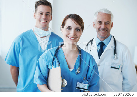 Happy, portrait and doctor with nurses in hospital with clipboard for medical research in collaboration. Smile, checklist and senior male surgeon with healthcare workers in clinic for teamwork. 139780269