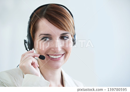 Woman, callcenter and phone call with headset and mic, CRM or contact us with smile for communication. Telecom, customer service or telemarketing with agent for tech support or help desk at office 139780595