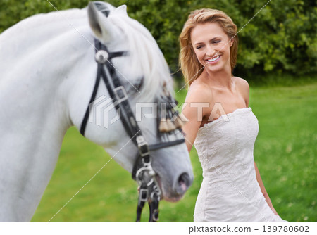 Wedding, woman and happy with horse outdoor on grass for celebration, marriage or confidence in countryside. Bride, person and stallion on lawn in field with smile, dress or animal at event in nature Wedding, woman and happy with horse outdoor on grass for celebration, marriage or confidence in countryside. Bride, person and stallion on lawn in field with smile, dress or animal at event in nature 139780602