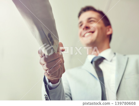 Handshake, business people and agreement in partnership, teamwork and thank you for recruitment. Male person, low angle and deal for merger in workplace, collaboration and support in cooperation 139780608