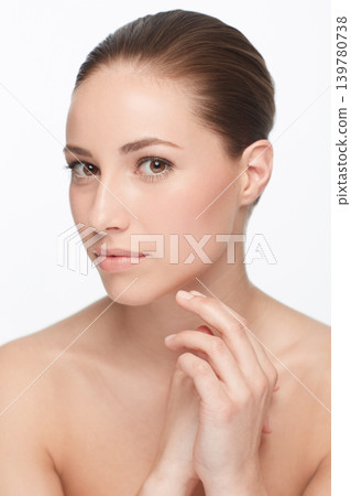 Portrait, beauty and facial with natural woman in studio isolated on white background for wellness treatment. Face, skincare aesthetic and confident young model at spa for cosmetics or dermatology 139780738
