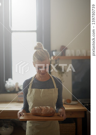 Bakery, kitchen and woman with bread on tray for cooking with healthy gluten free food for breakfast. Fresh, loaf and chef in restaurant with rye or sourdough for brunch, meal or lunch with nutrition 139780739