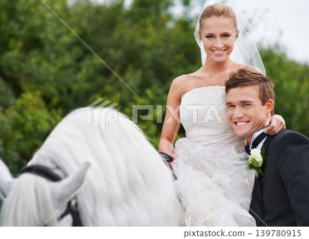 Couple, marriage and horse with nature, countryside and celebration for love, portrait and smile. Groom, wife and uk forest with happiness, wedding and horse riding for honeymoon, vacation or holiday 139780915