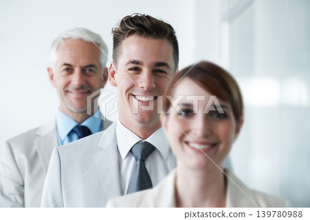Smiling , friendly group of three businesspeople , and of different age private company staff posing for office portrait. Diverse business partners , team of colleagues professionals working office Smiling , friendly group of three businesspeople , and of different age private company staff posing for office portrait. Diverse business partners , team of colleagues professionals working office 139780988
