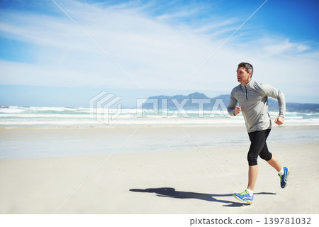 Sand, space or man at beach running for exercise, training or outdoor workout at sea for fitness. Sports person, mature runner or healthy athlete in nature for cardio endurance, wellness or mockup Sand, space or man at beach running for exercise, training or outdoor workout at sea for fitness. Sports person, mature runner or healthy athlete in nature for cardio endurance, wellness or mockup 139781032