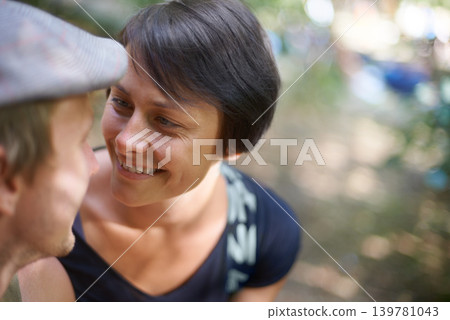 Couple, happy and together with smile outdoors for love, bonding and collaboration in nature. Man, woman and flat cap with appreciation for relationship, marriage or partnership from high angle Couple, happy and together with smile outdoors for love, bonding and collaboration in nature. Man, woman and flat cap with appreciation for relationship, marriage or partnership from high angle 139781043