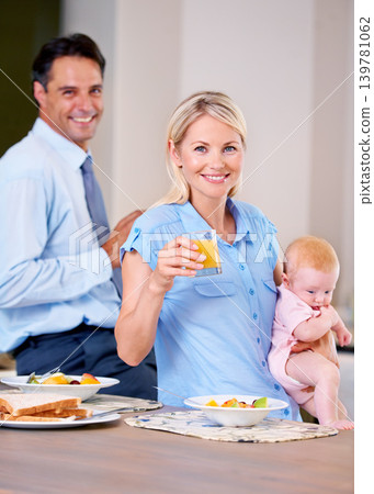 Family, baby and house with breakfast, love and family with fruit, health and wellness. Parents, daughter and orange juice with routine, morning and kitchen for portrait, happy and face for mom Family, baby and house with breakfast, love and family with fruit, health and wellness. Parents, daughter and orange juice with routine, morning and kitchen for portrait, happy and face for mom 139781062