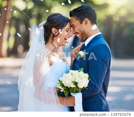 Smile, couple and confetti at wedding with love, romantic ceremony and commitment celebration. Laugh, bride and groom with bokeh, partnership and emotional connection at special occasion for marriage 139781070