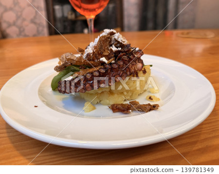 Pulpo de Galicia, octopus with mashed potatoes and crispy garnish Pulpo de Galicia, octopus with mashed potatoes and crispy garnish 139781349