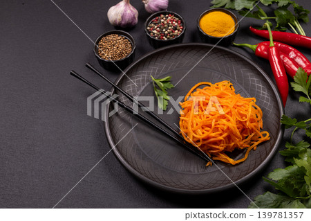 Spicy carrot salad with asian spices and chopsticks Spicy carrot salad with asian spices and chopsticks 139781357