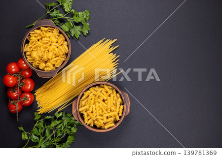 Italian pasta ingredients with fresh tomatoes and parsley Italian pasta ingredients with fresh tomatoes and parsley 139781369