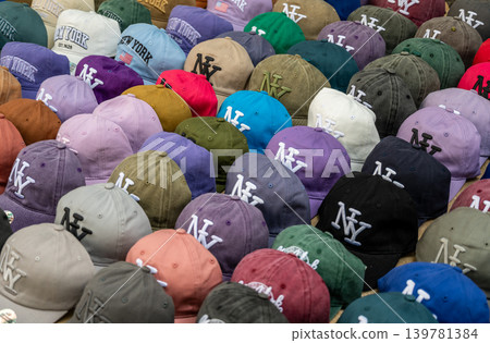 New york, usa august 18,2024. Colorful new york caps and baseball hats on display in a souvenir shop, evoking travel, tourism and urban fashion choices New york, usa august 18,2024. Colorful new york caps and baseball hats on display in a souvenir shop, evoking travel, tourism and urban fashion choices 139781384