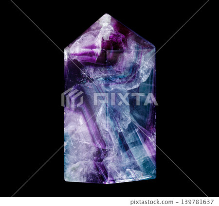 Polished Rainbow Fluorite Crystal Point on Black Background Polished Rainbow Fluorite Crystal Point on Black Background 139781637