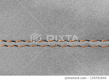 Close-up of Gray suede leather texture with double stitching Close-up of Gray suede leather texture with double stitching 139781644