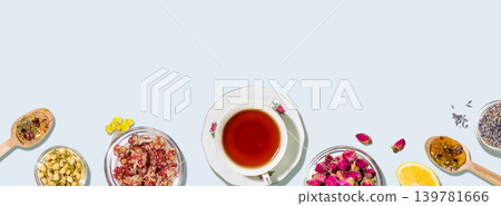 Herbal Tea Composition With Natural Ingredients On Light Blue Background Herbal Tea Composition With Natural Ingredients On Light Blue Background 139781666