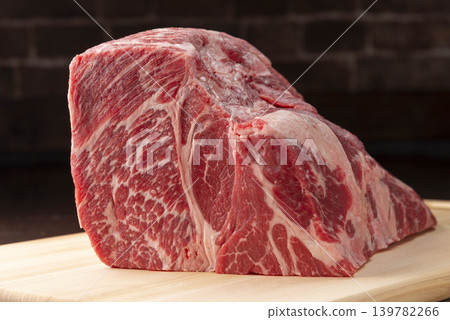 High-quality marbled Wagyu beef steak, served on a wooden cutting board. High-quality marbled Wagyu beef steak, served on a wooden cutting board. 139782266