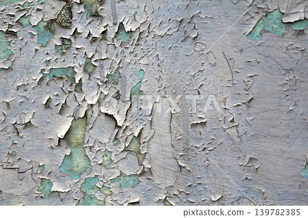Old cracked abstract grunge vintage texture copy space background, retro pattern. White irregular spots paint peeling of light blue concrete or wooden wall or ceiling flat surface. Old cracked abstract grunge vintage texture copy space background, retro pattern. White irregular spots paint peeling of light blue concrete or wooden wall or ceiling flat surface. 139782385