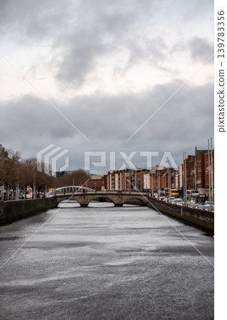 Dublin Ireland Cityscape Along River Liffey with Historic Bridges Waterfront Buildings Dublin Ireland Cityscape Along River Liffey with Historic Bridges Waterfront Buildings 139783356
