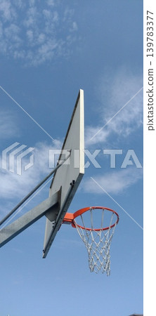 Basket for a sports ball against the blue sky Basket for a sports ball against the blue sky 139783377