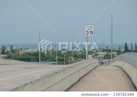 Coastal Bridge Pedestrian Walkway Towards Clearwater Florida with 35 MPH Speed Limit Sign Coastal Bridge Pedestrian Walkway Towards Clearwater Florida with 35 MPH Speed Limit Sign 139783389