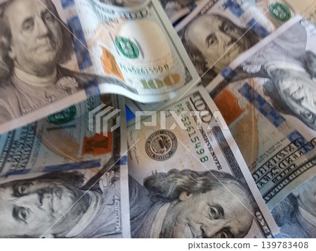 A bunch of dollar bills with different faces on them.Concept of wealth and prosperity background A bunch of dollar bills with different faces on them.Concept of wealth and prosperity background 139783408