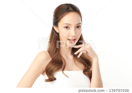 A beautiful young Asian woman with clean, fresh skin against a white background. Skincare, facial treatment, cosmetology, beauty, and spa. An elegant portrait of an Asian woman. A beautiful young Asian woman with clean, fresh skin against a white background. Skincare, facial treatment, cosmetology, beauty, and spa. An elegant portrait of an Asian woman. 139783508