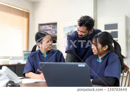 Foreign caregivers having a meeting in the staff room Foreign caregivers having a meeting in the staff room 139783649