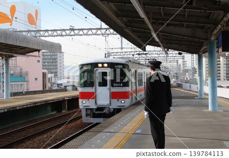 The platform and station staff at Hanshin Railway's Chifune Station. The platform and station staff at Hanshin Railway's Chifune Station. 139784113