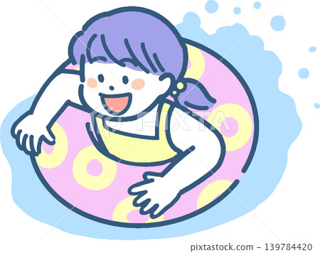 一個女孩在救生圈上玩耍。 一個女孩在救生圈上玩耍。 139784420