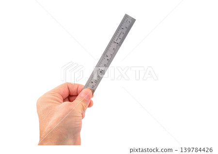 person holding steel measuring ruler on isolated white background 139784426