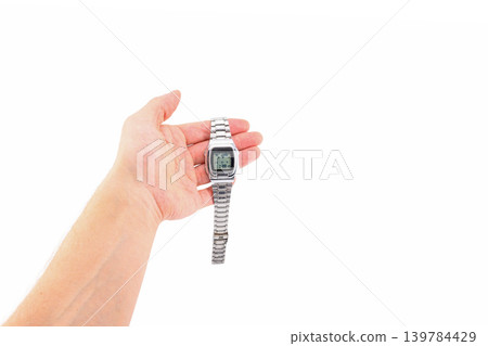 electronic wristwatch lying on open male palm 139784429