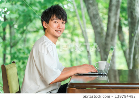 A young man who is an address hopper and does workation/remote work. A young man who is an address hopper and does workation/remote work. 139784482