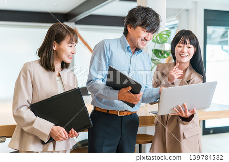 Boss in a company office, male executive businessman and assistant, female secretary staff Boss in a company office, male executive businessman and assistant, female secretary staff 139784582