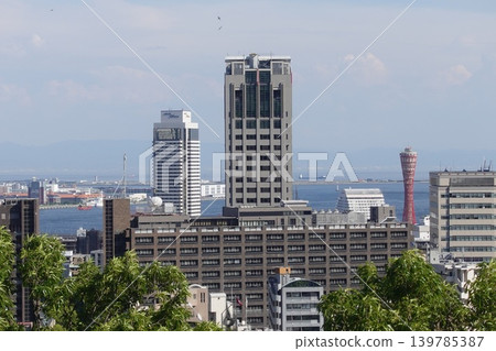 A telephoto view of the city, capturing Kobe Port Tower and the surrounding cityscape. A telephoto view of the city, capturing Kobe Port Tower and the surrounding cityscape. 139785387