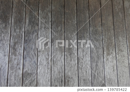 Background texture material of a wall lined with old gray wooden planks. Background texture material of a wall lined with old gray wooden planks. 139785422