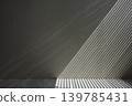 Abstract background of light and shadow from blinds spread across the wall and floor. 139785431