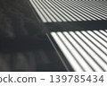 Close-up background of light and shadow from blinds cast on the floor. 139785434