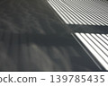 Abstract background material of light and shadow from blurred blinds. 139785435