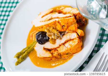 Spicy turkey breast in mango dipping sauce 139785615
