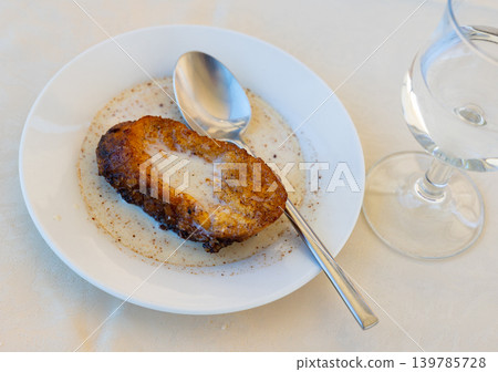 Sweet Spanish Easter torrija de leche served with creamy sauce 139785728