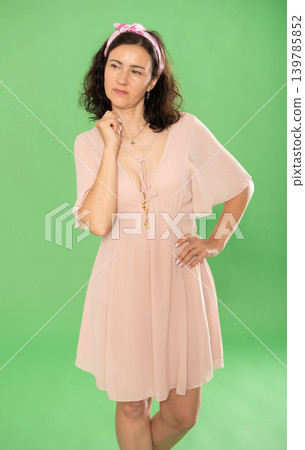 Portrait of adult woman in casual clothes posing in studio. Chroma key compositing 139785852