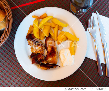 Appetising sliced pork served with potato 139786035